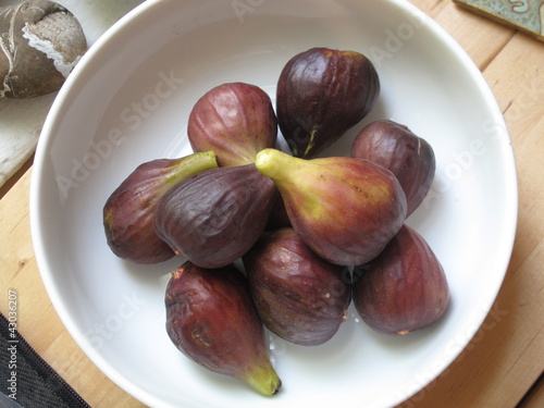 Photo: Fresh picked summer figs in kitchen bowl Fresh picked summer figs in kitchen bowl
