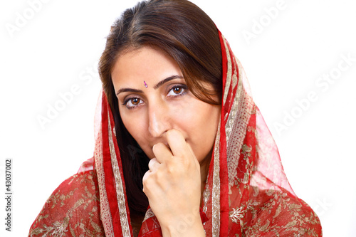 Photo: Indian lady with thoughtful expression Indian lady with thoughtful expression