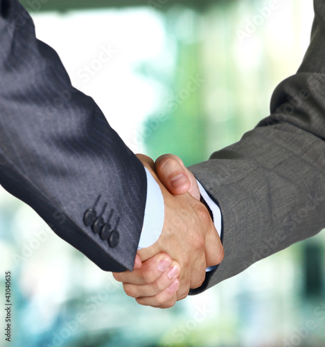 Photo: Two businessman shaking hands Two businessman shaking hands