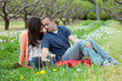 Affectionate Couple Together on Picnic Blanket