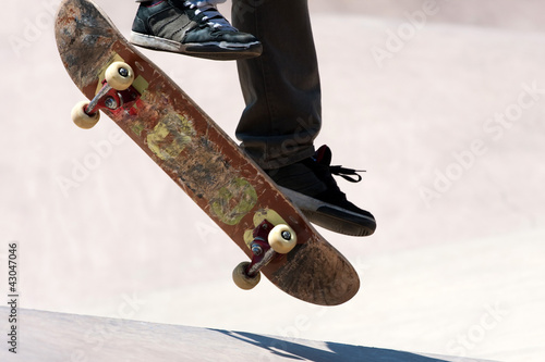 Photo: Skateboarder Jumping Tricks Skateboarder Jumping Tricks