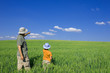 Father and son pointing out at the copyspace for your text