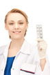attractive female doctor with pills