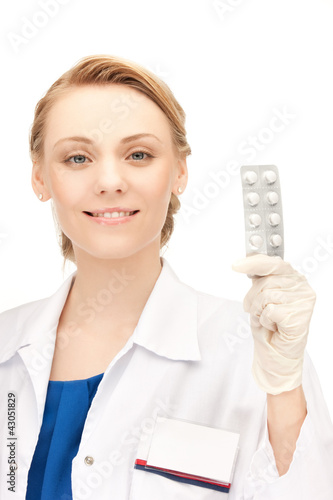 Photo: attractive female doctor with pills attractive female doctor with pills
