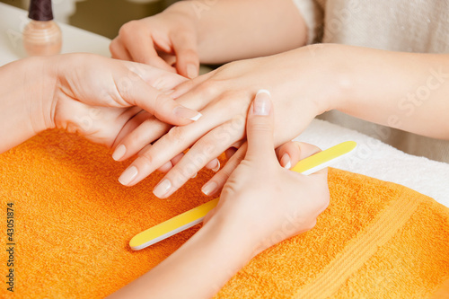 Photo: manicure process on female hands manicure process on female hands