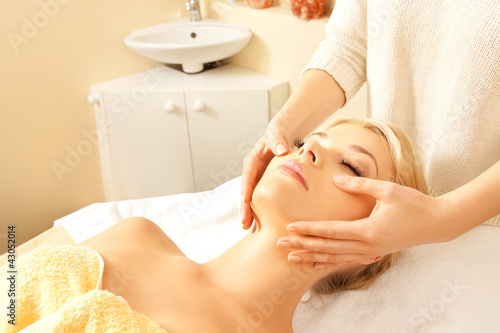 Photo: beautiful woman in massage salon beautiful woman in massage salon