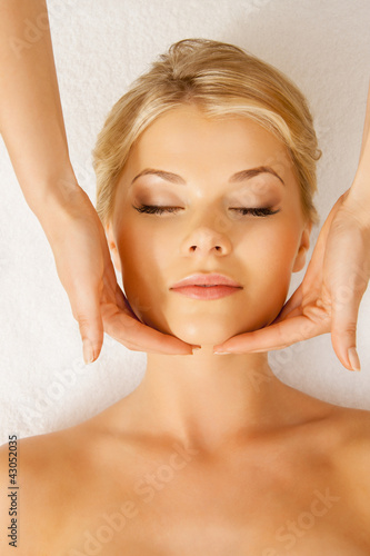 Photo: beautiful woman in massage salon beautiful woman in massage salon