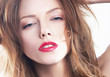 Beautiful woman's purity face with bright red lips make-up