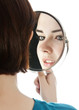 young woman holding a mirror