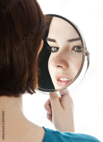Photo: young woman holding a mirror young woman holding a mirror