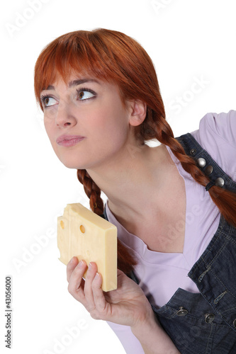 Photo: Woman with a block of Swiss cheese Woman with a block of Swiss cheese