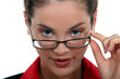 secretary with glasses lowered on her nose