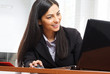 Smiling woman using a laptop