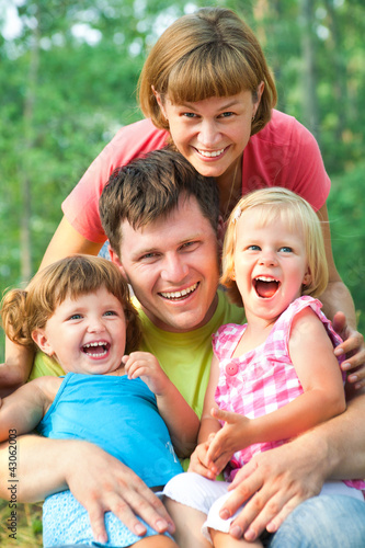 Photo: happy family in summertime happy family in summertime