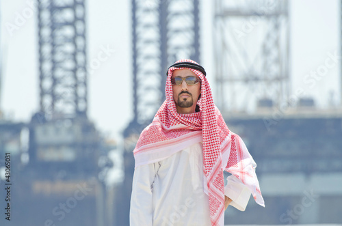 Photo: Arab on seaside in traditional clothing Arab on seaside in traditional clothing