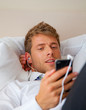 portrait of a businessman with music player smartphone