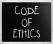 Illustration: "Code of ethics" handwritten with white chalk on a blackboard "Code of ethics" handwritten with white chalk on a blackboard