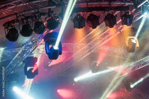 Photo: colorful spotlights on an entertainment venue stage colorful spotlights on an entertainment venue stage