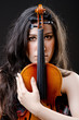Female violin player against background