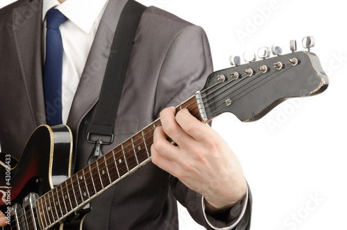 Photo: Young guitar player isolated on white Young guitar player isolated on white