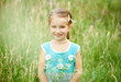 Cute little girl  on the meadow