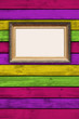 Photo: Blank Picture Frame on Multicolored Wooden Wall Blank Picture Frame on Multicolored Wooden Wall