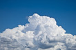 white fluffy clouds over blue sky landscape