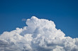 white fluffy clouds over blue sky landscape