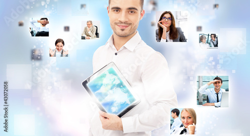 Photo: Portrait of young happy man sharing his photo and video files in Portrait of young happy man sharing his photo and video files in
