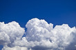 white fluffy clouds over blue sky landscape