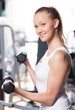 Woman exercising with dumbbells