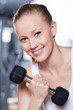Woman exercising with dumbbells