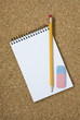 Photo: Pencil with eraser and notebook on cork 2 Pencil with eraser and notebook on cork 2