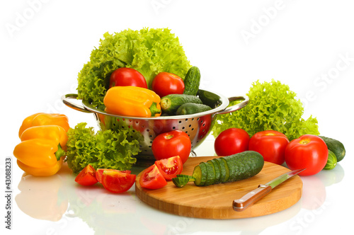 Photo: fresh vegetables and knife on cutting board isolated on white fresh vegetables and knife on cutting board isolated on white