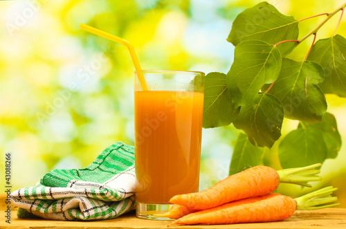 Photo: glass of carrot juice and fresh carrots glass of carrot juice and fresh carrots
