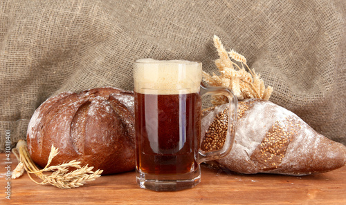 Photo: glass of kvass with bread on canvas background close-up glass of kvass with bread on canvas background close-up