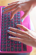 Girl on laptop typing word "no" on chat