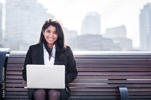 Photo: Indian businesswoman with laptop Indian businesswoman with laptop