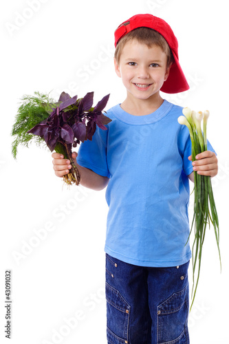 Photo: Smiling boy with greens Smiling boy with greens