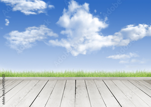 Photo: Wooden terrace looking out over a tropical cloud sky Wooden terrace looking out over a tropical cloud sky