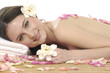 Photo: Spa resort –girl in rose petal with orchid Spa resort –girl in rose petal with orchid