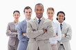 Close-up of a business team smiling and crossing their arms