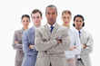 Close-up of a serious business team crossing their arms