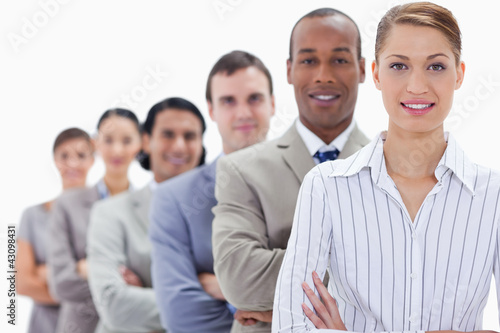 Photo: Close-up of a business team crossing their arms in a single line Close-up of a business team crossing their arms in a single line