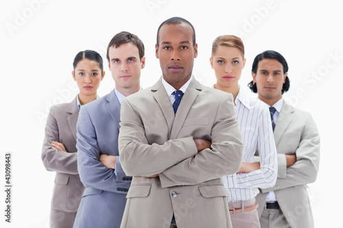 Foto: Close-up of a serious business team crossing their arms Close-up of a serious business team crossing their arms