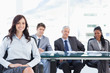 Photo: Young businesswoman sitting with her hand on her leg and accompa Young businesswoman sitting with her hand on her leg and accompa