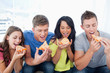 Friends eating pizza together