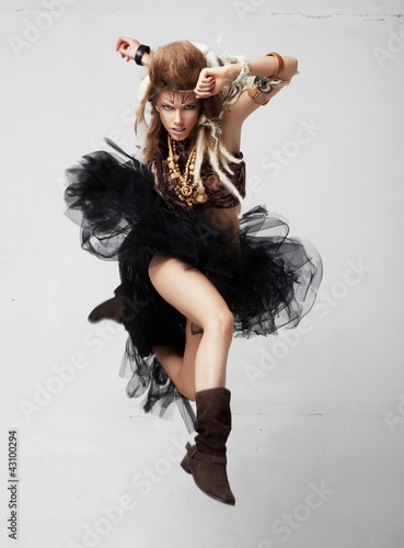 Photo: Vintage. Retro style. Excited female jumping in joy. Antique Vintage. Retro style. Excited female jumping in joy. Antique