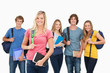 Smiling group stand together with one girl standing in front