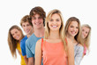 Group standing behind one another at varied angles